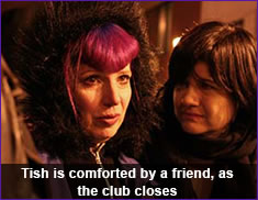 Tish is comforted by a friend, as the club closes