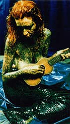 Carol Lipnik as mermaid playing udkelele