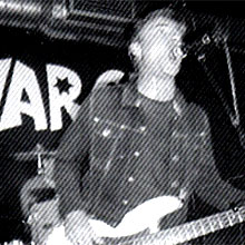 Glen Matlock playing bass and singing